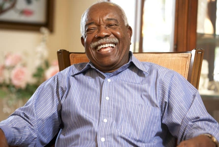 a senior smiles at the camera
