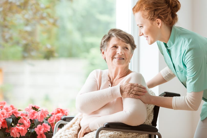 an in home caregiver comforts their client in Seattle