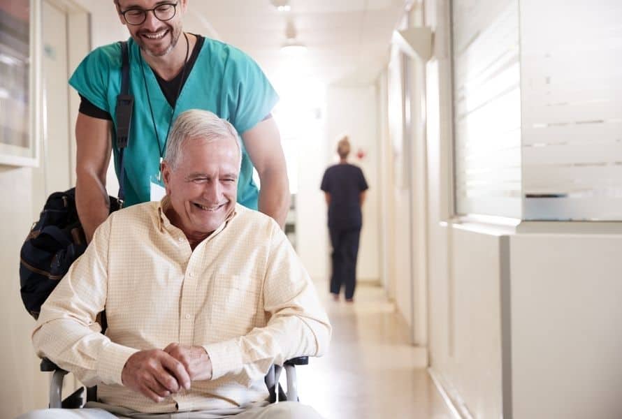 a senior preparing for hospital discharge with the help of a nurse