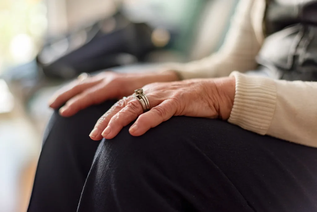 Senior Hands Resting With Ring in Natural Light