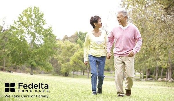 senior couple walking in the park