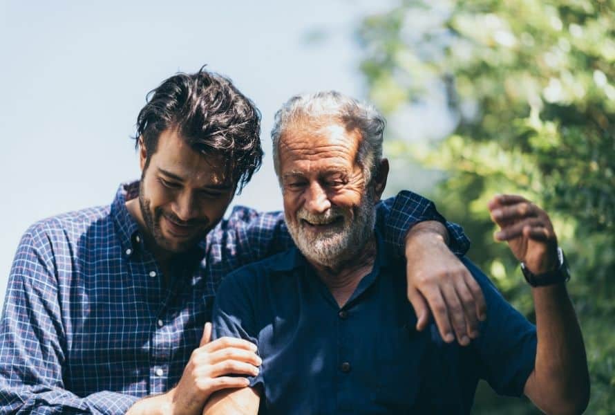 a son walks with their senior dad
