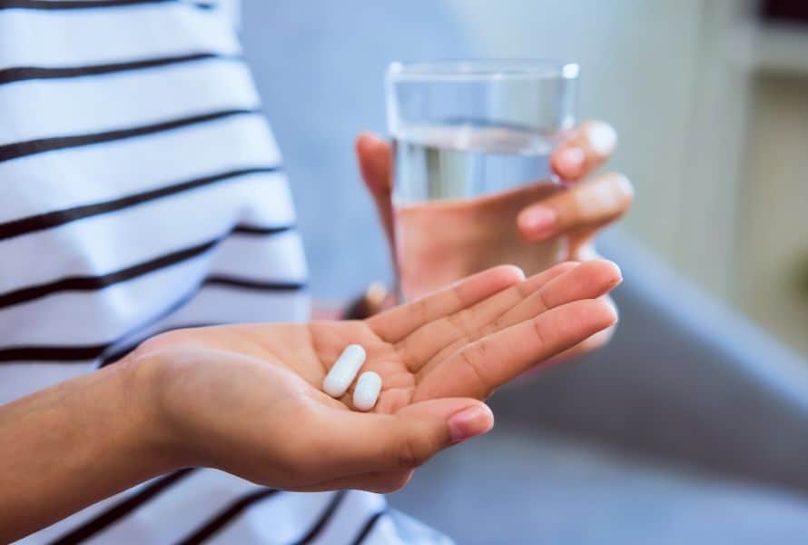 medication management exemplified by an individual taking medicine