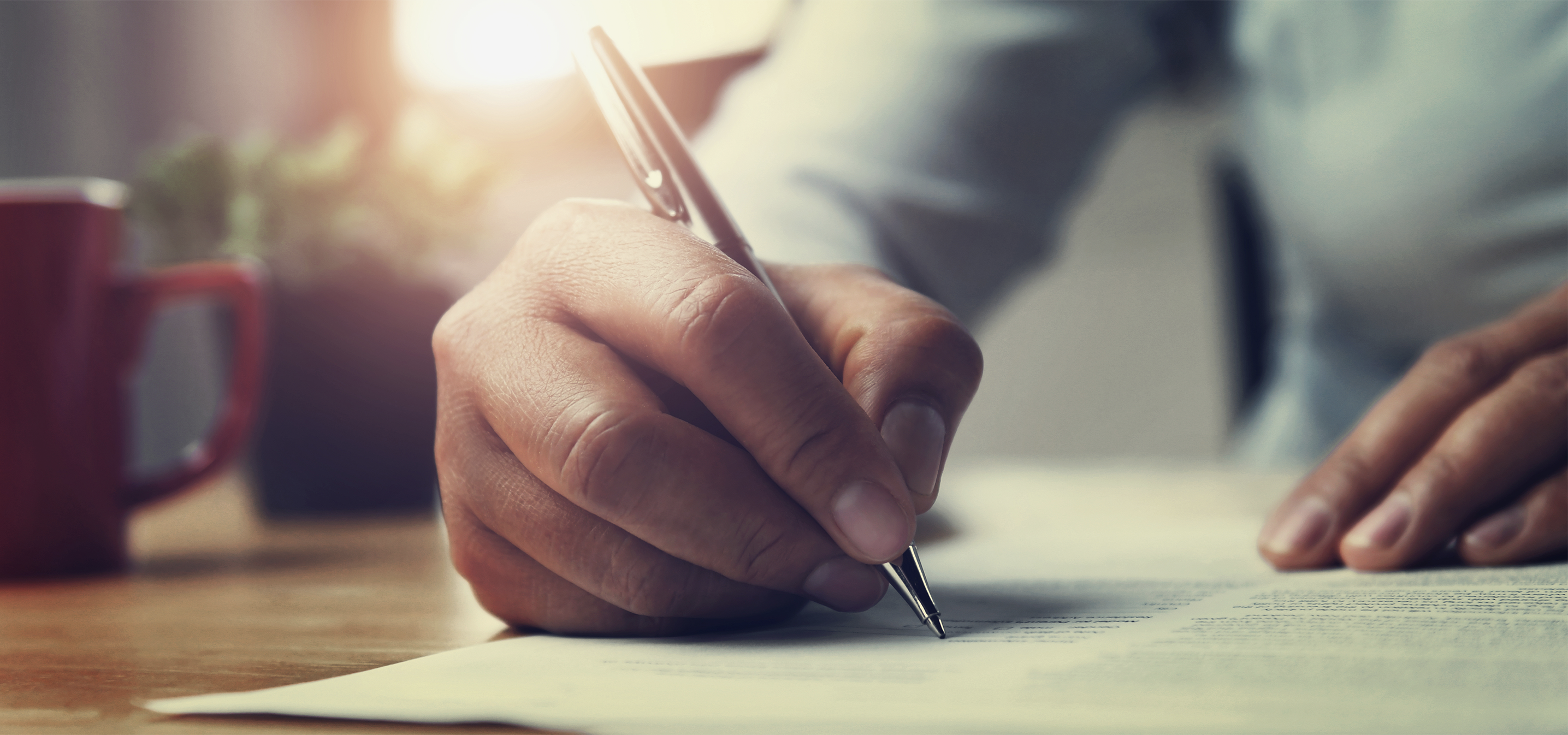 A photo of a person writing a letter