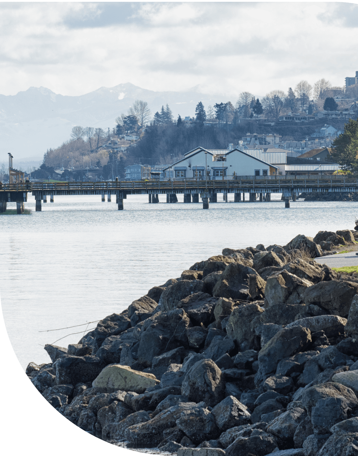 view of water and bridge in Federal Way with mountains in background