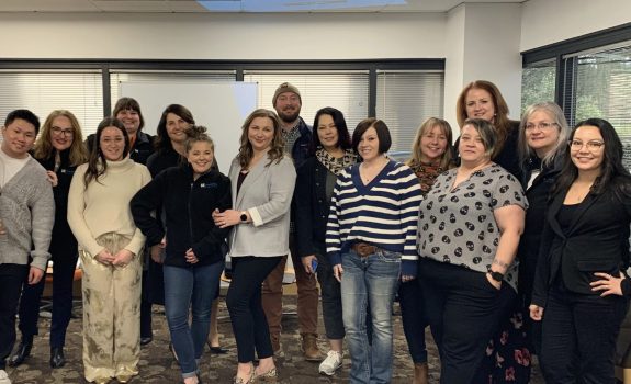 The Fedelta Home Care team poses for a team photo in Federal Way