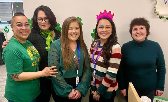 Fedelta Home Care employees pose for a photo during a St. Patrick's networking event